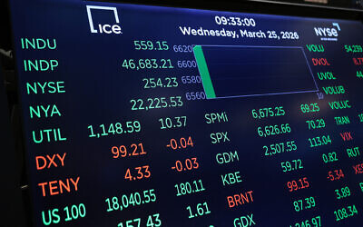 Stock market numbers are displayed on the floor of the New York Stock Exchange during morning trading on March 25, 2026, in New York City. (Michael M. Santiago/Getty Images/AFP)