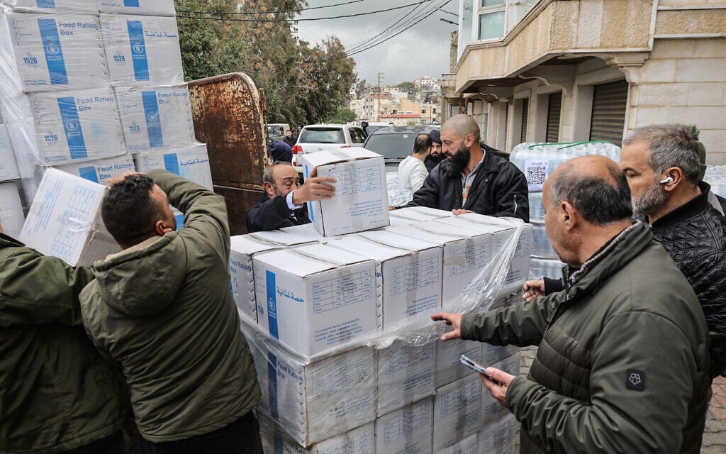 United Nations humanitarian aid parcels are unloaded in the Christian border village of Qlayaa in south-eastern Lebanon on March 27, 2026. (AFP) United Nations humanitarian aid parcels are unloaded in the Christian border village of Qlayaa in south-eastern Lebanon on March 27, 2026. (AFP)