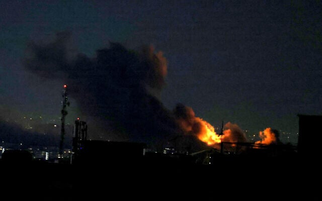 A plume of smoke rises from the site of a strike in Tehran on March 29, 2026. (ATTA KENARE / AFP)