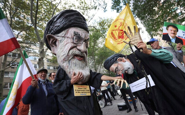 Illustrative: Protesters wearing costumes depicting Iranian Supreme Leader Ayatollah Ali Khamenei, left, and former Iranian President Ebrahim Raisi, right, September 21, 2021, UN General Assembly in New York. (AP Photo/Jason DeCrow)