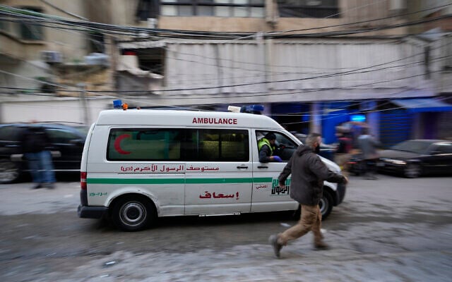 Illustrative: A man runs next to an ambulance arriving at the site of an Israeli airstrike that targeted a building in Beirut, Lebanon, November 26, 2024. (AP Photo/Hassan Ammar) Illustrative: A man runs next to an ambulance arriving at the site of an Israeli airstrike that targeted a building in Beirut, Lebanon, November 26, 2024. (AP Photo/Hassan Ammar)