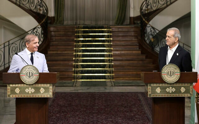 Iran's President Masoud Pezeshkian, right, speaks in a joint press conference with Pakistan's Prime Minister Shehbaz Sharif at the Saadabad Palace in Tehran, Iran, May 26, 2025. (Iranian Presidency Office via AP)