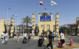 Illustrative: People cross the border from Israel into Egypt via the Taba Land Port, June 19, 2025. (AP)