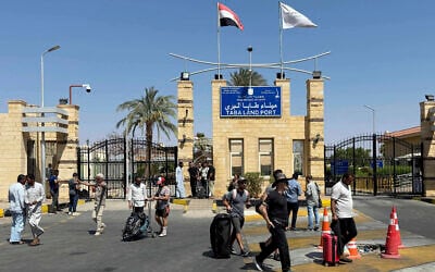 Illustrative: People cross the border from Israel into Egypt via the Taba Land Port, June 19, 2025. (AP)