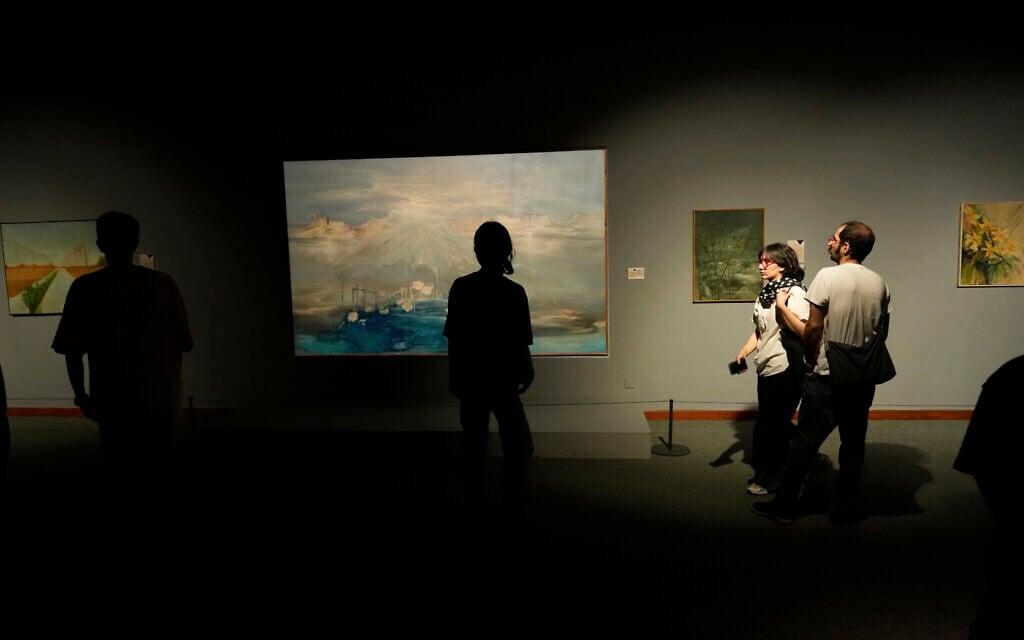People visit an exhibition called 'In Women's Word' showing some artworks of modern Iranian women artists from the collection of the Tehran Museum of Contemporary Art, Iran, on August 3, 2025. (AP Photo/Vahid Salemi)