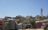 A view of the Palestinian hamlet of Umm al-Khair in the West Bank with the Israeli settlement of Carmel visible in the background, August 4, 2025. (AP/ Julia Frankel)