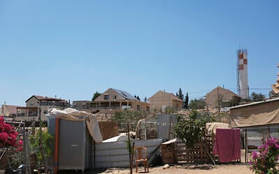 A view of the Palestinian hamlet of Umm al-Khair in the West Bank with the Israeli settlement of Carmel visible in the background, August 4, 2025. (AP/ Julia Frankel)