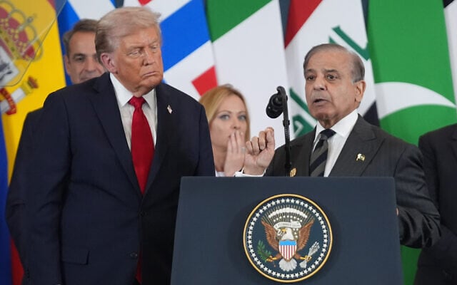 US President Donald Trump listens as Pakistan's Prime Minister Shehbaz Sharif speaks during a summit to support ending the more than two-year Israel-Hamas war in Gaza after a breakthrough ceasefire deal, on October 13, 2025, in Sharm El Sheikh, Egypt. (AP Photo/Evan Vucci)