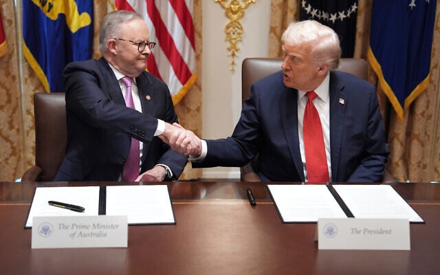 US President Donald Trump, right, shakes hands with Australian Prime Minister Anthony Albanese during a meeting in the Cabinet Room of the White House in Washington on October 20, 2025. (AP Photo/Evan Vucci)