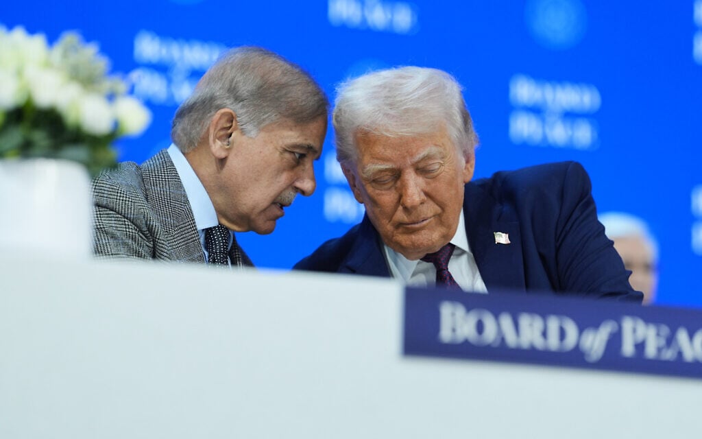 President Donald Trump, right, speaks with Shehbaz Sharif, Prime Minister of Pakistan, during a signing of the Board of Peace charter during the Annual Meeting of the World Economic Forum in Davos, Switzerland, January 22, 2026. (AP Photo/Evan Vucci)