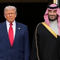 US President Donald Trump (left) stands with Saudi Arabia's Crown Prince Mohammed bin Salman on his visit to the White House, in Washington, November 18, 2025. (Mark Schiefelbein/AP)