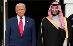 US President Donald Trump (left) stands with Saudi Arabia's Crown Prince Mohammed bin Salman on his visit to the White House, in Washington, November 18, 2025. (Mark Schiefelbein/AP)