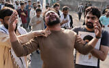 Shiite Muslims mourn the death of Iranian Supreme Leader Ayatollah Ali Khamenei during a protest against the US and Israel in Lahore, Pakistan, March 1, 2026. (AP Photo/K.M. Chaudary)