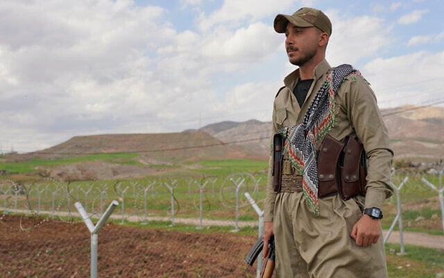 Member of the Democratic Party of Iranian Kurdistan PDKI stands at a checkpoint leading to their base in Koya district of Irbil, Iraq, Friday, Feb. 27, 2026. (AP Photo/Rashid Yahya) Member of the Democratic Party of Iranian Kurdistan PDKI stands at a checkpoint leading to their base in Koya district of Irbil, Iraq, Friday, Feb. 27, 2026. (AP Photo/Rashid Yahya)