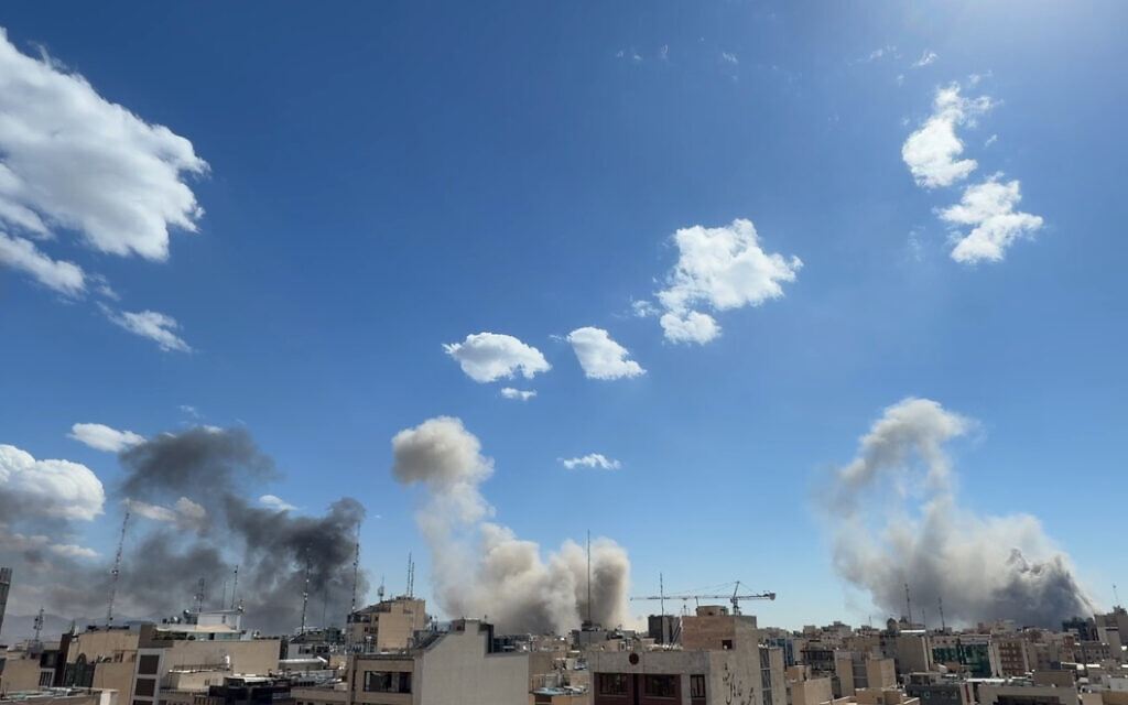 Plumes of smoke rise after a strike in Tehran, Iran, Sunday, March 1, 2026. (AP)
