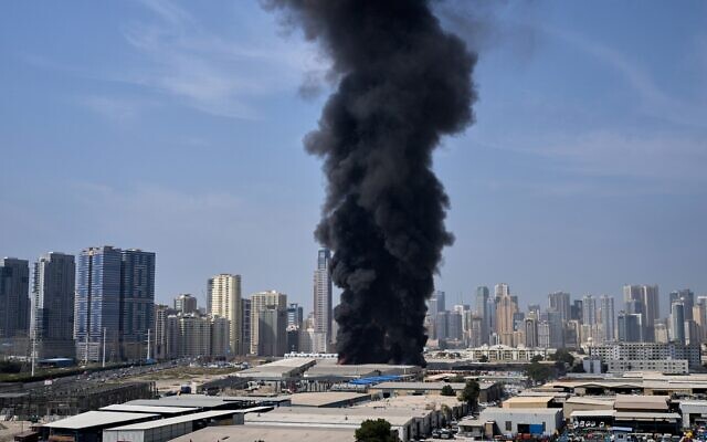 A black plume of smoke rises from a warehouse at the industrial area of Sharjah City in the United Arab Emirates following reports of Iranian strikes in Dubai, United Arab Emirates, March 1, 2026. (AP Photo/Altaf Qadri) A black plume of smoke rises from a warehouse at the industrial area of Sharjah City in the United Arab Emirates following reports of Iranian strikes in Dubai, United Arab Emirates, March 1, 2026. (AP Photo/Altaf Qadri)