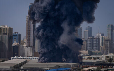 A black plume of smoke rises from a warehouse at the industrial area of Sharjah City in the United Arab Emirates following reports of Iranian strikes in Dubai, United Arab Emirates, March 1, 2026. (AP Photo/Altaf Qadri) A black plume of smoke rises from a warehouse at the industrial area of Sharjah City in the United Arab Emirates following reports of Iranian strikes in Dubai, United Arab Emirates, March 1, 2026. (AP Photo/Altaf Qadri)
