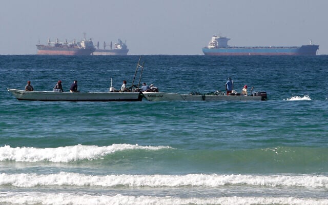 Fishermen work in front of oil tankers south of the Strait of Hormuz Jan. 19, 2012, offshore the town of Ras Al Khaimah in United Arab Emirates. (AP/Kamran Jebreili) Fishermen work in front of oil tankers south of the Strait of Hormuz Jan. 19, 2012, offshore the town of Ras Al Khaimah in United Arab Emirates. (AP/Kamran Jebreili)