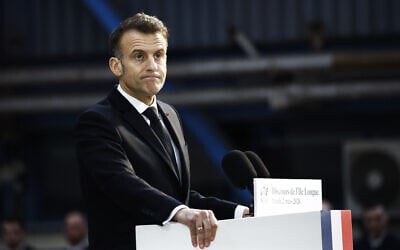 French President Emmanuel Macron delivers a speech next to the submarine 'Le Temeraire' at the nuclear submarines' Navy base of Ile Longue in Crozon, France, March 2, 2026. (Yoan Valat/Pool Photo via AP)