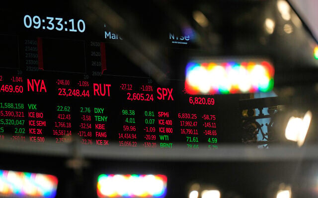 Financial data is displayed on the floor at the New York Stock Exchange in New York, March 2, 2026. (AP/Seth Wenig)