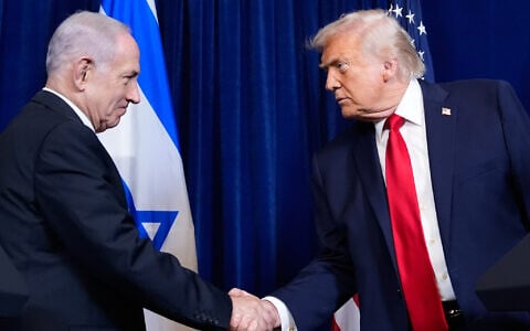US President Donald Trump, right, shakes hands with Prime Minister Benjamin Netanyahu during a news conference at Mar-a-Lago, in Palm Beach, Florida, December 29, 2025. (Alex Brandon/AP)