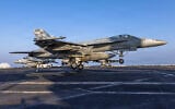 This image provided by US Central Command shows a F/A-18E Super Hornet making an arrested landing on the USS Abraham Lincoln (CVN 72) in support of Operation Epic Fury on March 2, 2026. (US Navy via AP)