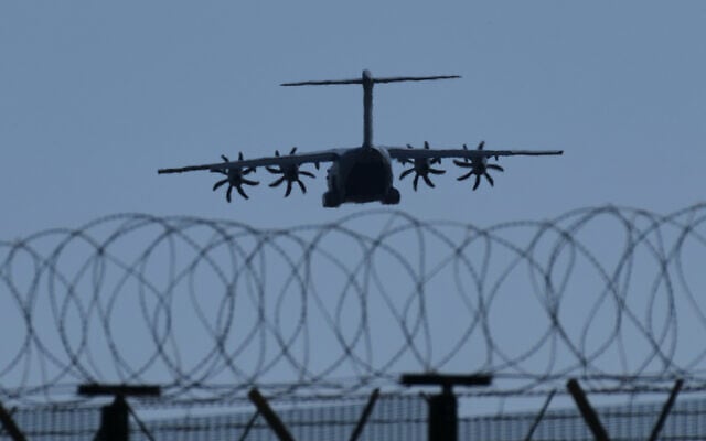 A transport aircraft prepares for landing at UK's RAF Akrotiri air base near Limassol, Cyprus, March, 3, 2026. (AP/Petros Karadjias)