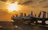This handout image shows aircraft on the flight deck of the USS Abraham Lincoln (CVN 72) that are operating in support of the war in Iran, March 3, 2026. (US Navy via AP)