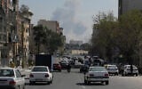 A plume of smoke rises following a US-Israeli strike in Tehran, Iran, March 4, 2026. (AP/Vahid Salemi)