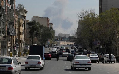 A plume of smoke rises following a US-Israeli strike in Tehran, Iran, March 4, 2026. (AP/Vahid Salemi)