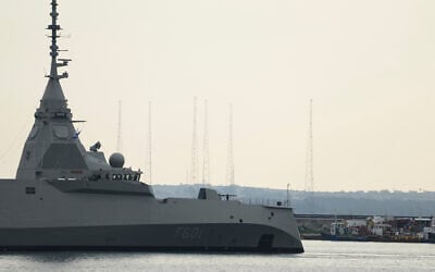 The Greek frigate Kimon enters the port of Limassol as the Akrotiri air base is seen in the background, Cyprus, on Wednesday, March 4, 2026. (AP Photo/Petros Karadjias)