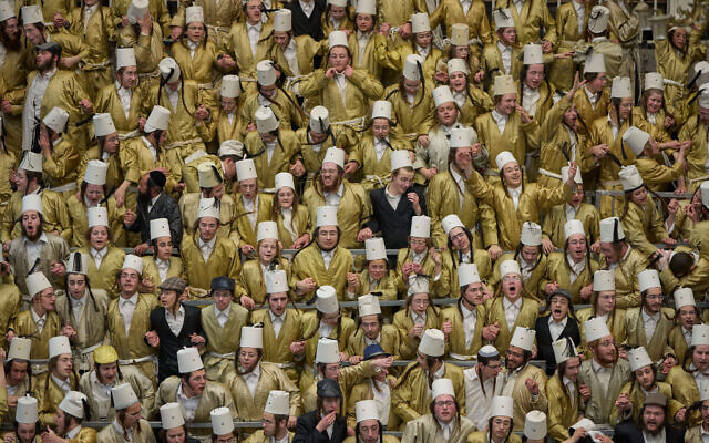 Ultra-Orthodox Jewish men celebrate the festival of Purim in Jerusalem, amid the war with Iran, March 4, 2026. (AP Photo/Ohad Zwigenberg)