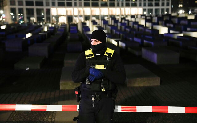 A police officer stands guard at the Holocaust memorial in Berlin, Germany, following a stabbing there on February 21, 2025. (Ebrahim Noroozi/AP) A police officer stands guard at the Holocaust memorial in Berlin, Germany, following a stabbing there on February 21, 2025. (Ebrahim Noroozi/AP)