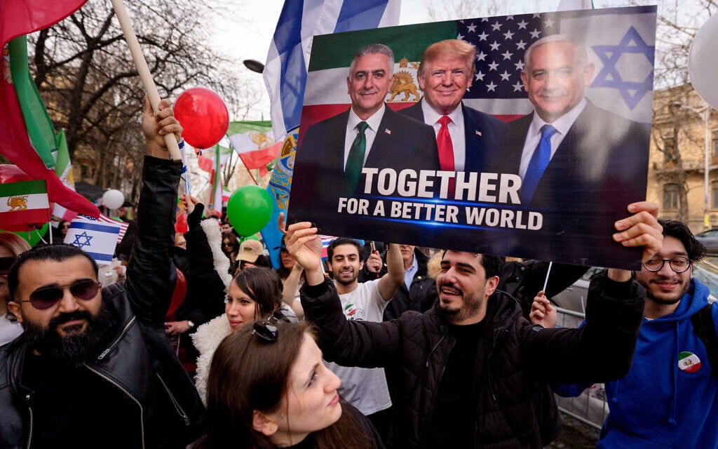A member of the Iranian community holds a poster during a rally outside the Iranian embassy in Bucharest, Romania, Thursday, March 5, 2026. (AP Photo/Andreea Alexandru)