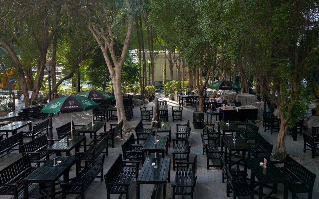 A patron sits at an outdoor restaurant in Dubai, United Arab Emirates, Thursday, March 5, 2026. (AP Photo/Altaf Qadri)