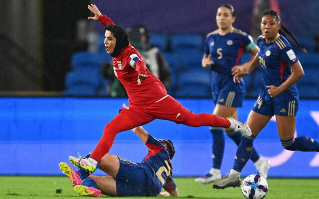 Iran's Zahra Sarbali, top, and Philippines' Malea Cesar battle for the ball during the Women's Asian Cup soccer match between Iran and the Philippines in Robina, Australia, March 8, 2026. (Dave Hunt/AAP Image via AP) Iran's Zahra Sarbali, top, and Philippines' Malea Cesar battle for the ball during the Women's Asian Cup soccer match between Iran and the Philippines in Robina, Australia, March 8, 2026. (Dave Hunt/AAP Image via AP)