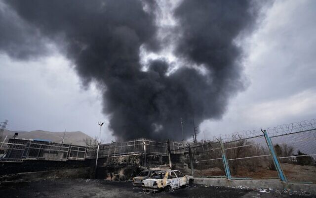 A thick plume of smoke rises from an oil storage facility hit by a strike in Tehran, Iran, Sunday, March 8, 2026. (AP Photo/Vahid Salemi) A thick plume of smoke rises from an oil storage facility hit by a strike in Tehran, Iran, Sunday, March 8, 2026. (AP Photo/Vahid Salemi)