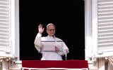 Pope Leo XIV appears at his studio's window overlooking St. Peter's Square at the Vatican for the traditional Sunday blessing of the faithful gathered for the noon Angelus prayer, March 8, 2026. (AP/Gregorio Borgia)