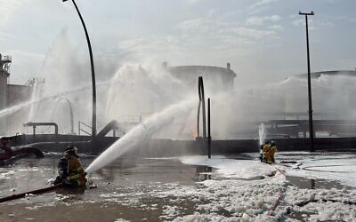 Illustrative: This image released by Bahrain's Interior Ministry shows firefighters extinguishing flames after an Iranian projectile struck an industrial area in Ma'ameer, Bahrain, Monday, March 9, 2026. (Bahrain Interior Ministry via AP)
