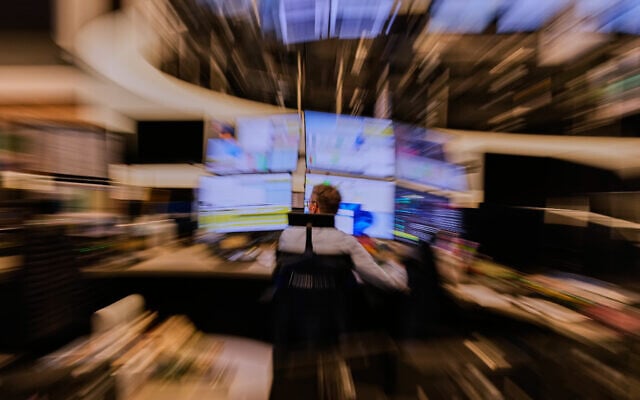 A broker watches his screens at the stock market in Frankfurt, Germany, March 9, 2026. (AP Photo/Michael Probst) A broker watches his screens at the stock market in Frankfurt, Germany, March 9, 2026. (AP Photo/Michael Probst)