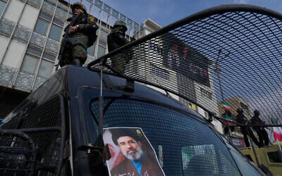 A poster of Ayatollah Mojtaba Khamenei, the successor to his late father Ayatollah Ali Khamenei as supreme leader is placed on an anti-riot police car as policemen stand on top of the car, during a rally to support him in Tehran, Iran, March 9, 2026 (AP Photo/Vahid Salemi) A poster of Ayatollah Mojtaba Khamenei, the successor to his late father Ayatollah Ali Khamenei as supreme leader is placed on an anti-riot police car as policemen stand on top of the car, during a rally to support him in Tehran, Iran, March 9, 2026 (AP Photo/Vahid Salemi)