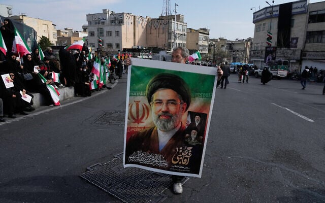 A man holds a poster of Ayatollah Mojtaba Khamenei during a rally in Tehran, Iran, March 9, 2026. (AP Photo/Vahid Salemi) A man holds a poster of Ayatollah Mojtaba Khamenei during a rally in Tehran, Iran, March 9, 2026. (AP Photo/Vahid Salemi)