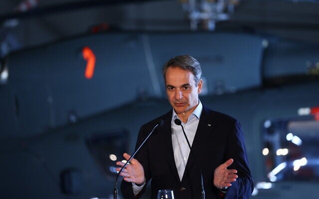Greek Prime Minister Kyriakos Mitsotakis speaks during a joint press conference with French President Emmanuel Macron and Cypriot President Nikos Christodoulides at Paphos military airport, Paphos, Cyprus, on March 9, 2026. (Gonzalo Fuentes/Pool Photo via AP)