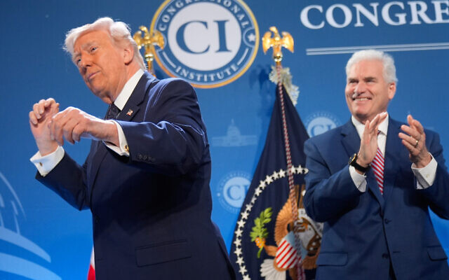 President Donald Trump dances as Rep. Tom Emmer, R-Minn., watches at the Republican Members Issues Conference, Monday, March 9, 2026, at Trump National Doral Miami in Doral, Fla. (AP Photo/Mark Schiefelbein) President Donald Trump dances as Rep. Tom Emmer, R-Minn., watches at the Republican Members Issues Conference, Monday, March 9, 2026, at Trump National Doral Miami in Doral, Fla. (AP Photo/Mark Schiefelbein)