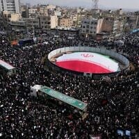 Mourners attend the funeral procession for senior Iranian military officials and some civilians killed during the U.S.-Israel campaign, in Tehran, Iran, Wednesday, March 11, 2026. (AP Photo/Vahid Salemi)