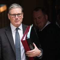Britain's Prime Minister Keir Starmer leaves 10 Downing Street to attend the weekly Prime Ministers' Questions session in parliament in London, March 11, 2026. (Frank Augstein/AP)