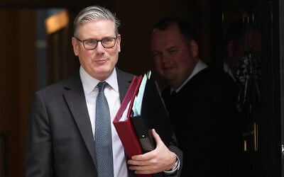 Britain's Prime Minister Keir Starmer leaves 10 Downing Street to attend the weekly Prime Ministers' Questions session in parliament in London, March 11, 2026. (Frank Augstein/AP)