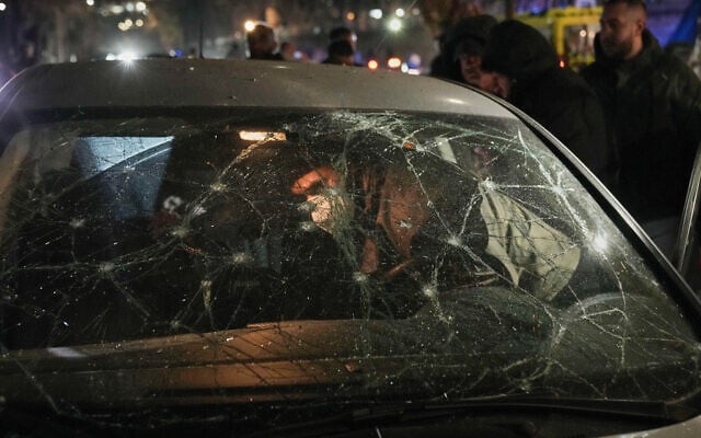 A man inspects a damaged car hit in an Israeli airstrike targeting Hezbollah operatives at the Ramlet al-Baida public beach, in Beirut, Lebanon, March 12, 2026. (AP Photo/Bilal Hussein) A man inspects a damaged car hit in an Israeli airstrike targeting Hezbollah operatives at the Ramlet al-Baida public beach, in Beirut, Lebanon, March 12, 2026. (AP Photo/Bilal Hussein)
