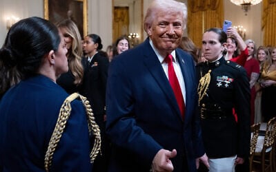 US President Donald Trump departs a women's history month event in the East Room of the White House, March 12, 2026, in Washington, DC. (AP/Julia Demaree Nikhinson)