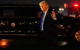 US President Donald Trump waves after arriving on Air Force One at Palm Beach International Airport in West Palm Beach, Florida, March 13, 2026. (AP Photo/Mark Schiefelbein)